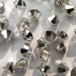 04-MC-00010-27001 Bicone, Crystal Half Labrador 4 mm. 50 Pc.-0
