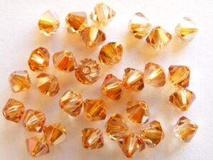 04-MC-00010-29121 Crystal Apricot bicones 4 mm