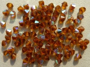 04-MC-10110-28701 Dark Topaz AB bicones 4 mm