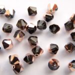 04-MC-30330-27101 Bicone, Montana Sapphire Capri Gold 4 mm. 50 St-0