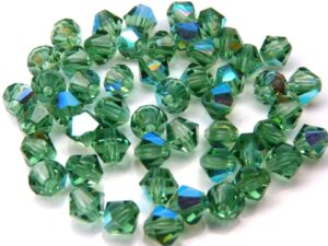 04-MC-50310-28701 Bicones, Turmaline AB 4 mm. 50 P:c.-11029