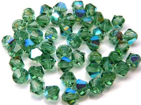 04-MC-50310-28701 Bicones, Turmaline AB 4 mm. 50 P:c.-11029