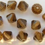 06-MC-10220 Bicone Smoke Topaz 6 mm. 24 Pc.-0