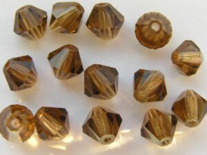 06-MC-10220 Bicone Smoke Topaz 6 mm. 24 Pc.-0