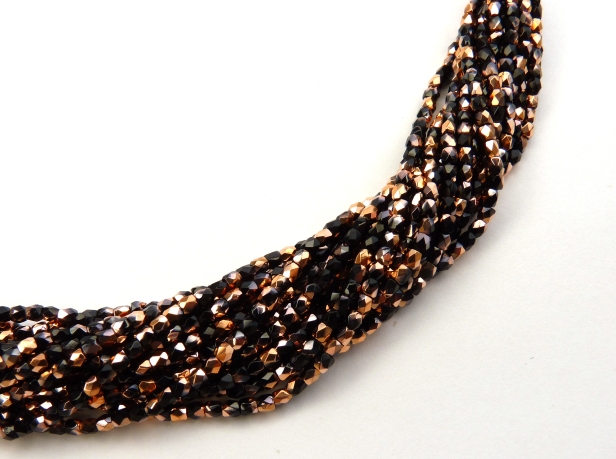 2FP-23980-27101 Fire Polished Jet Capri Gold 2 mm.-0