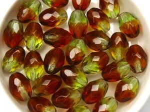 0100484 Olivine / Dark Topaz Mix Oval Facet 11 x 8 mm.14 Pc.-0