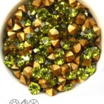 SS29-MCC-50230-98521 Olivine Gold Foiled Chaton 6 mm. 12 Pc.-0