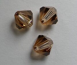 SW-05-SMTOLT 5301 Light Smoked Topaz Swarovski Bicone 5 mm. 10 Pc.-0