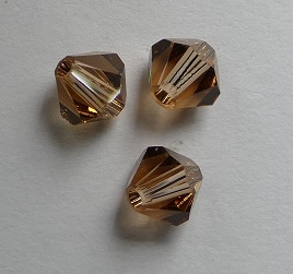 SW-05-SMTOLT 5301 Light Smoked Topaz Swarovski Bicone 5 mm. 10 Pc.-0