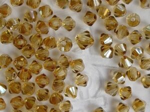 03-MC-10020-22501 Bicone, Light Topaz Celsian 3 mm. 50 Pc.-0