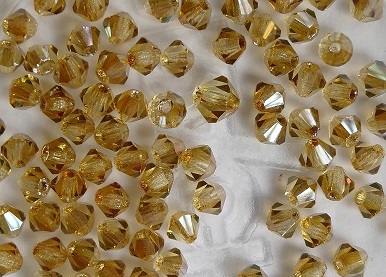 03-MC-10020-22501 Bicone, Light Topaz Celsian 3 mm. 50 Pc.-0