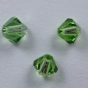 SW-04-PER 4 mm Peridot Swarovski Element Bicones - Afbeelding 1