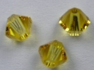 SW-04-TL 4 mm Topaz Light Swarovski Element Bicones