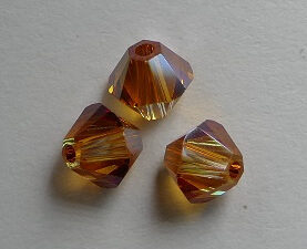 SW-04-CRYSAPR 4 mm Crystal Apricot Swarovski Element Bicones