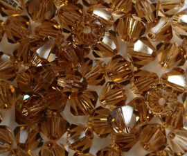 SW-05-SMTOLT 5 mm Light Smoked Topaz Swarovski Element Bicones - Afbeelding 2