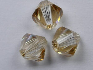 6 mm Crystal Golden Shadow Swarovski Element Bicones - Afbeelding 1