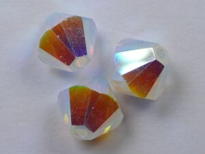 6 mm White Opal AB 2x Swarovski Element Bicones - Afbeelding 1