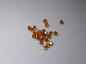 SW-04-TOAB 4 mm Topaz AB Swarovski Element Bicones - Afbeelding 1