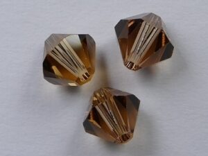 6 mm Light Smoked Topaz Swarovski Element Bicones - Afbeelding 1
