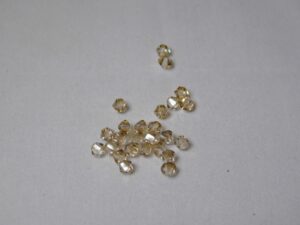 SW-04-CGS 4 mm Crystal Golden Shadow Element Bicones - Afbeelding 1