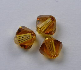 SW-05-TO 5 mm Topaz Swarovski Element Bicones - Afbeelding 1