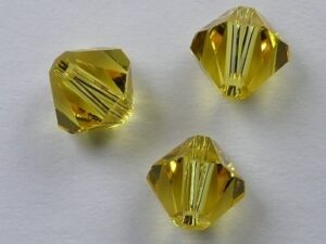 6 mm Light Topaz Swarovski Element Bicones - Afbeelding 1