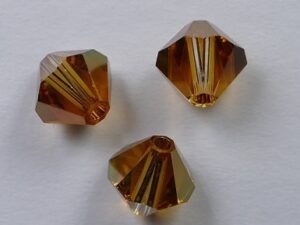 6 mm Crystal Copper Swarovski Element Bicones - Afbeelding 1