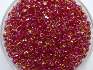 M-TRI-10-1164 Color Lined Amber with Rose Miyuki Triangle 10/0