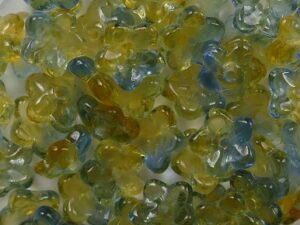 0060131 Druk Flower Caps Transparent Zacht Oranje met Blauw Melee 7 mm. 35 Pc - Afbeelding 1