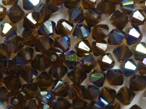 04-MC-10240-28701 Smoked Dark Topaz AB bicones 4 mm 50 stuks