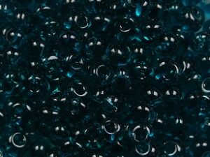 TM-03-0007BD Transparent Teal Magatama 3 mm. TOHO
