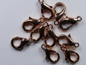 CL0022CP Karabijnslotjes copper plated, 15 mm. 4 Pc.