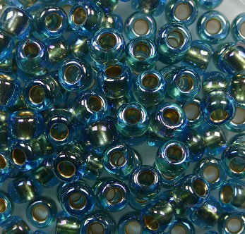 TR-06-0995 Toho Rocailles 6-0 Gold Lined Rainbow Aqua color 995