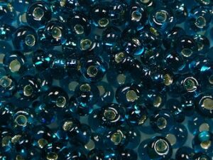 TM-03-0027BD Silver Lined Teal Magatama 3 mm. TOHO
