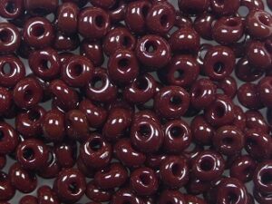 TM-03-0046 Opaque Oxblood Magatama 3 mm. TOHO