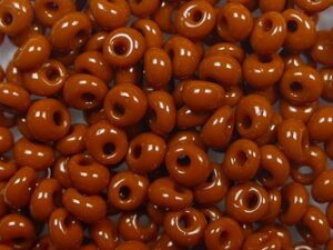 TM-03-0046L Opaque Terra Cotta Magatama 3 mm. TOHO