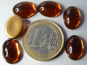 Cab-10090 Dark Topaz Oval Goldfoiled 14 x 10 mm. 6 stuks - Afbeelding 1