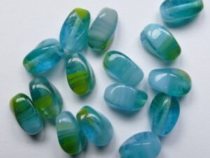 0090528 Mixed Opal-Transparent Blue-Green-White Czech Glass Carved Olive Bead 6x9 mm 12 stuks