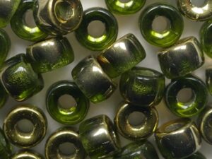 0100653 Olivine Dorado Roller Bead 6 mm. 50 Pc.