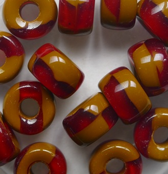 0030401 Siam Ruby Umber Rollerbeads 9x6 mm color S0380 Siam Ruby Umber Roller Bead 9x6 mm